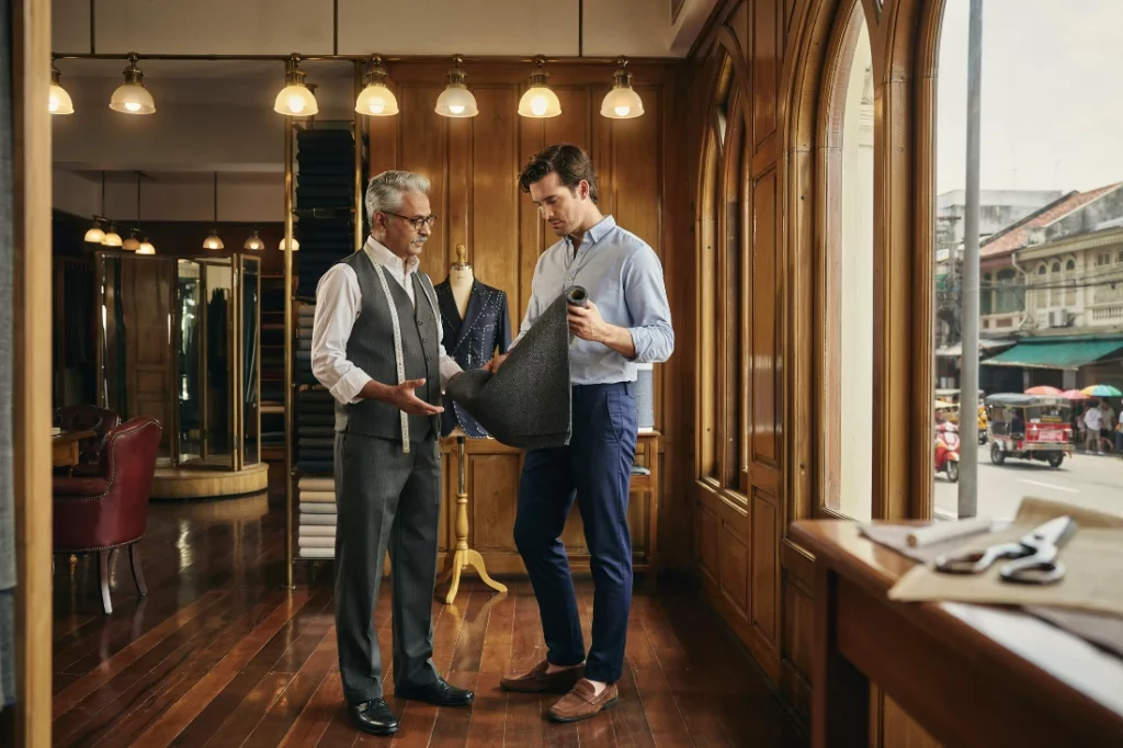 Best tailors in Bang Rak heritage showroom interior with master tailor consultation